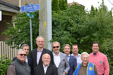 Welland Rotary Members unveil a new street sign