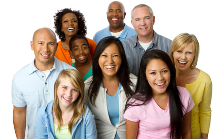 A group of people all facing the camera and smiling